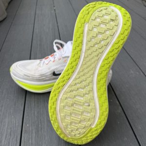 The outsole of a Nike Vomero Plus shoe.